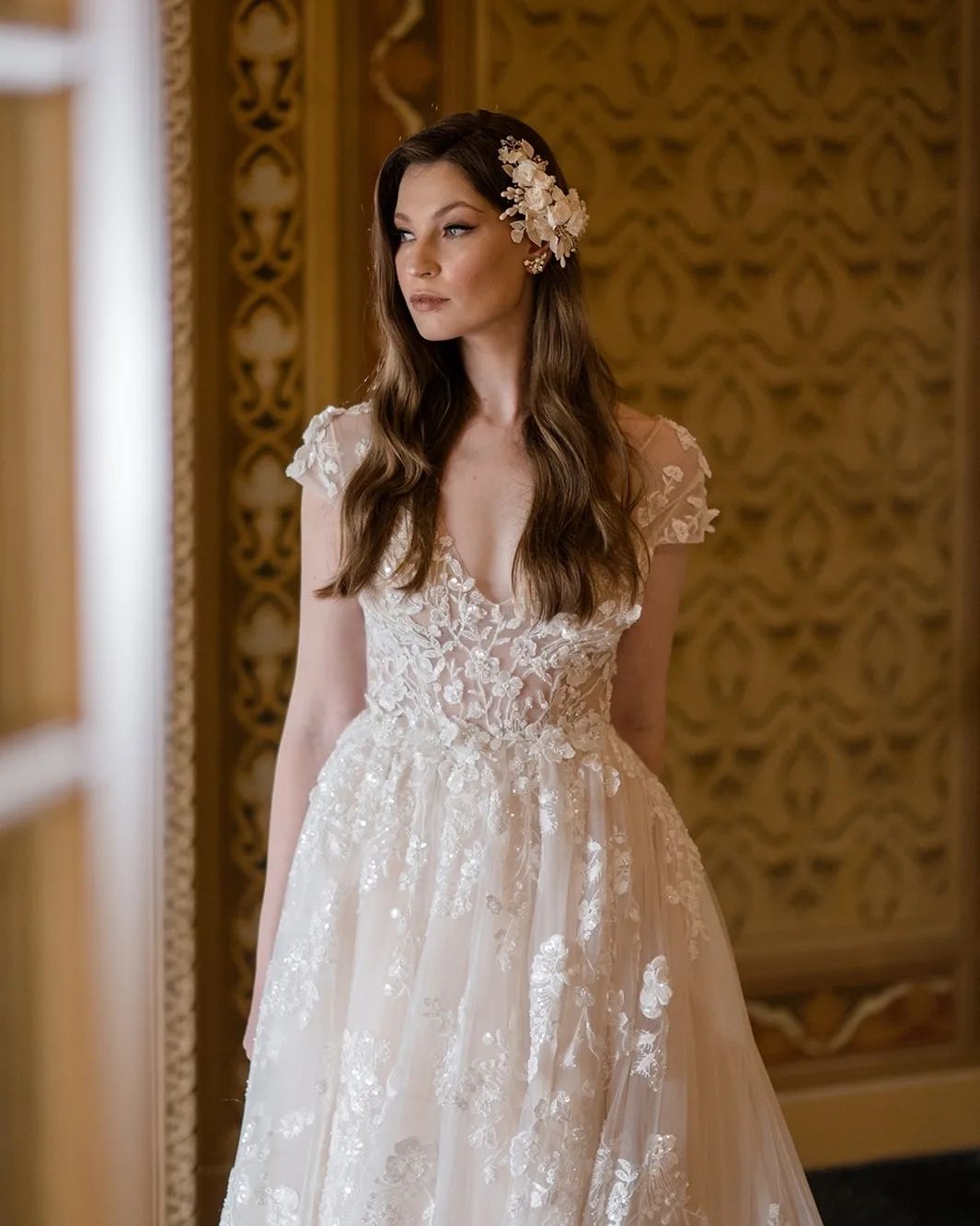 Elegant Long A-line V-neck Wedding Dress with Cap Sleeves and Lace Details