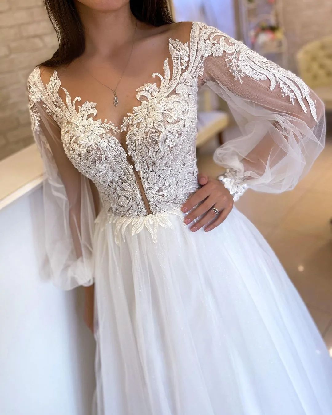 Refined White A-Line V-Neck Tulle Wedding Dress with Long Sleeves and Lace Details