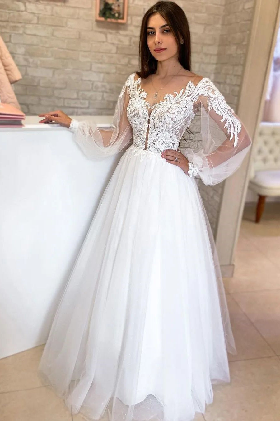 Refined White A-Line V-Neck Tulle Wedding Dress with Long Sleeves and Lace Details