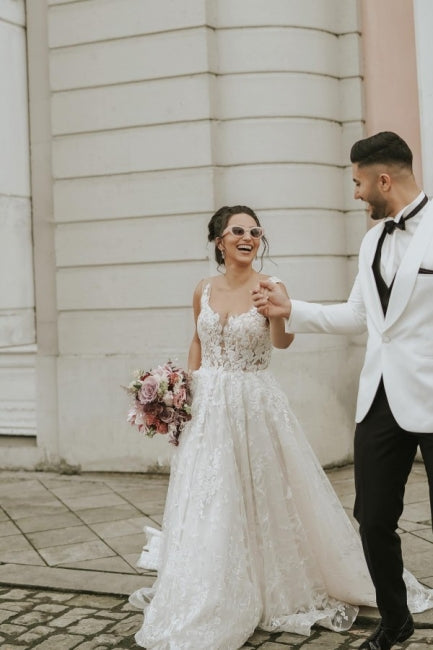 Ivory Sleeveless Straps A-Line Wedding Dress with Flowing Chapel Train